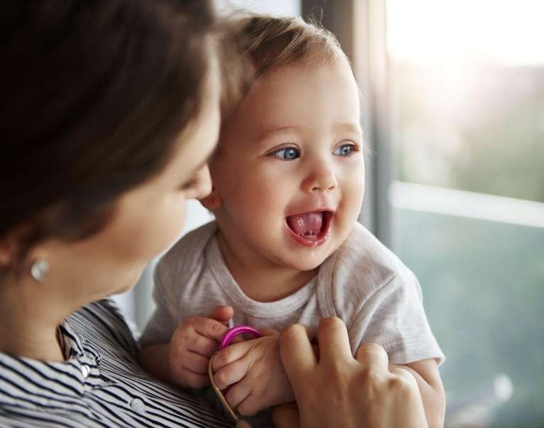baby smiling with mom | children's dentistry lara