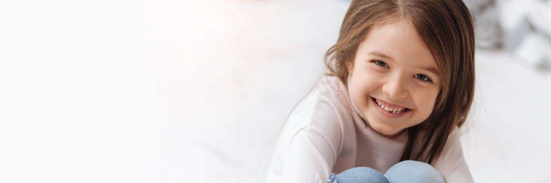 girl with brown hair smiling | dentist lara vic